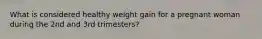 What is considered healthy weight gain for a pregnant woman during the 2nd and 3rd trimesters?