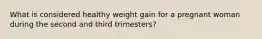 What is considered healthy weight gain for a pregnant woman during the second and third trimesters?