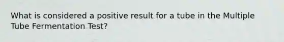 What is considered a positive result for a tube in the Multiple Tube Fermentation Test?