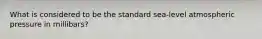 What is considered to be the standard sea-level atmospheric pressure in millibars?