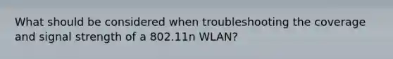 What should be considered when troubleshooting the coverage and signal strength of a 802.11n WLAN?