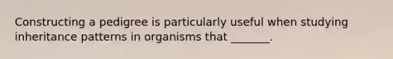 Constructing a pedigree is particularly useful when studying <a href='https://www.questionai.com/knowledge/knmHDuZZrC-inheritance-patterns' class='anchor-knowledge'>inheritance patterns</a> in organisms that _______.