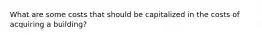 What are some costs that should be capitalized in the costs of acquiring a building?