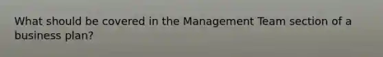 What should be covered in the Management Team section of a business plan?