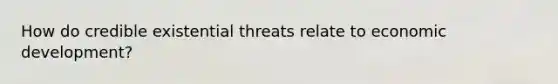 How do credible existential threats relate to economic development?