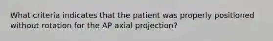 What criteria indicates that the patient was properly positioned without rotation for the AP axial projection?