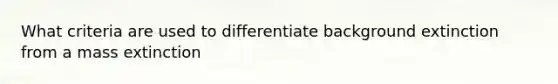 What criteria are used to differentiate background extinction from a mass extinction