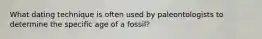 What dating technique is often used by paleontologists to determine the specific age of a fossil?