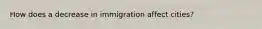 How does a decrease in immigration affect cities?