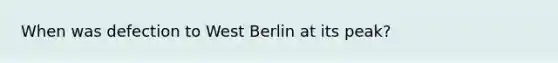 When was defection to West Berlin at its peak?