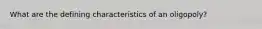 What are the defining characteristics of an oligopoly?