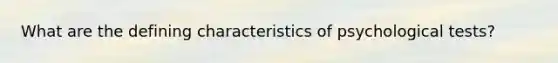 What are the defining characteristics of psychological tests?