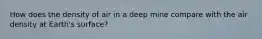 How does the density of air in a deep mine compare with the air density at Earth's surface?