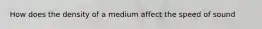 How does the density of a medium affect the speed of sound