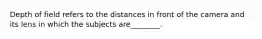 Depth of field refers to the distances in front of the camera and its lens in which the subjects are________.