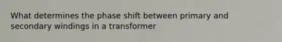 What determines the phase shift between primary and secondary windings in a transformer