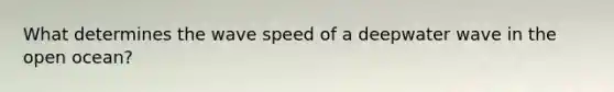 What determines the wave speed of a deepwater wave in the open ocean?