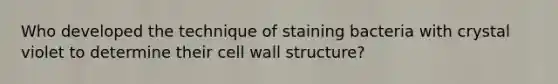 Who developed the technique of staining bacteria with crystal violet to determine their cell wall structure?