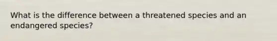 What is the difference between a threatened species and an endangered species?