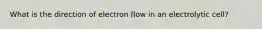 What is the direction of electron flow in an electrolytic cell?