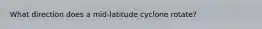 What direction does a mid-latitude cyclone rotate?