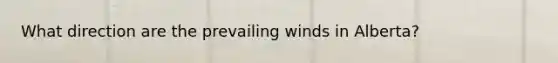 What direction are the prevailing winds in Alberta?