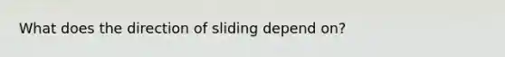 What does the direction of sliding depend on?