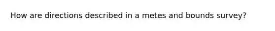 How are directions described in a metes and bounds survey?