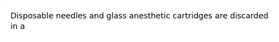 Disposable needles and glass anesthetic cartridges are discarded in a