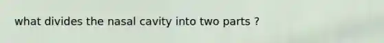 what divides the nasal cavity into two parts ?