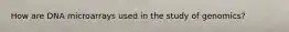 How are DNA microarrays used in the study of genomics?