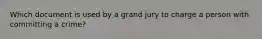 Which document is used by a grand jury to charge a person with committing a crime?