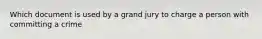 Which document is used by a grand jury to charge a person with committing a crime