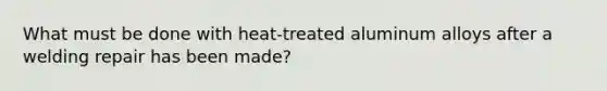 What must be done with heat-treated aluminum alloys after a welding repair has been made?