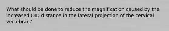 What should be done to reduce the magnification caused by the increased OID distance in the lateral projection of the cervical vertebrae?