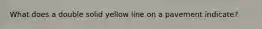 What does a double solid yellow line on a pavement indicate?