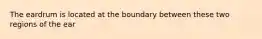 The eardrum is located at the boundary between these two regions of the ear