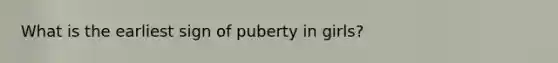 What is the earliest sign of puberty in girls?