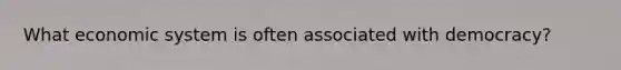 What economic system is often associated with democracy?