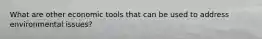 What are other economic tools that can be used to address environmental issues?