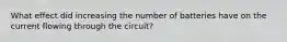 What effect did increasing the number of batteries have on the current flowing through the circuit?