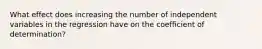 What effect does increasing the number of independent variables in the regression have on the coefficient of determination?