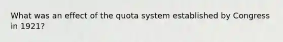 What was an effect of the quota system established by Congress in 1921?