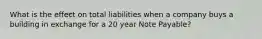 What is the effect on total liabilities when a company buys a building in exchange for a 20 year Note Payable?