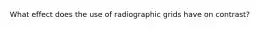 What effect does the use of radiographic grids have on contrast?