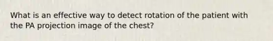 What is an effective way to detect rotation of the patient with the PA projection image of the chest?