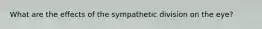 What are the effects of the sympathetic division on the eye?