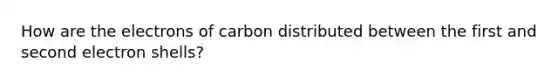 How are the electrons of carbon distributed between the first and second electron shells?