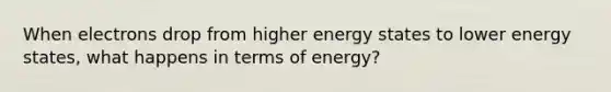 When electrons drop from higher energy states to lower energy states, what happens in terms of energy?