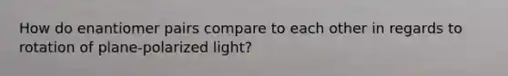 How do enantiomer pairs compare to each other in regards to rotation of plane-polarized light?